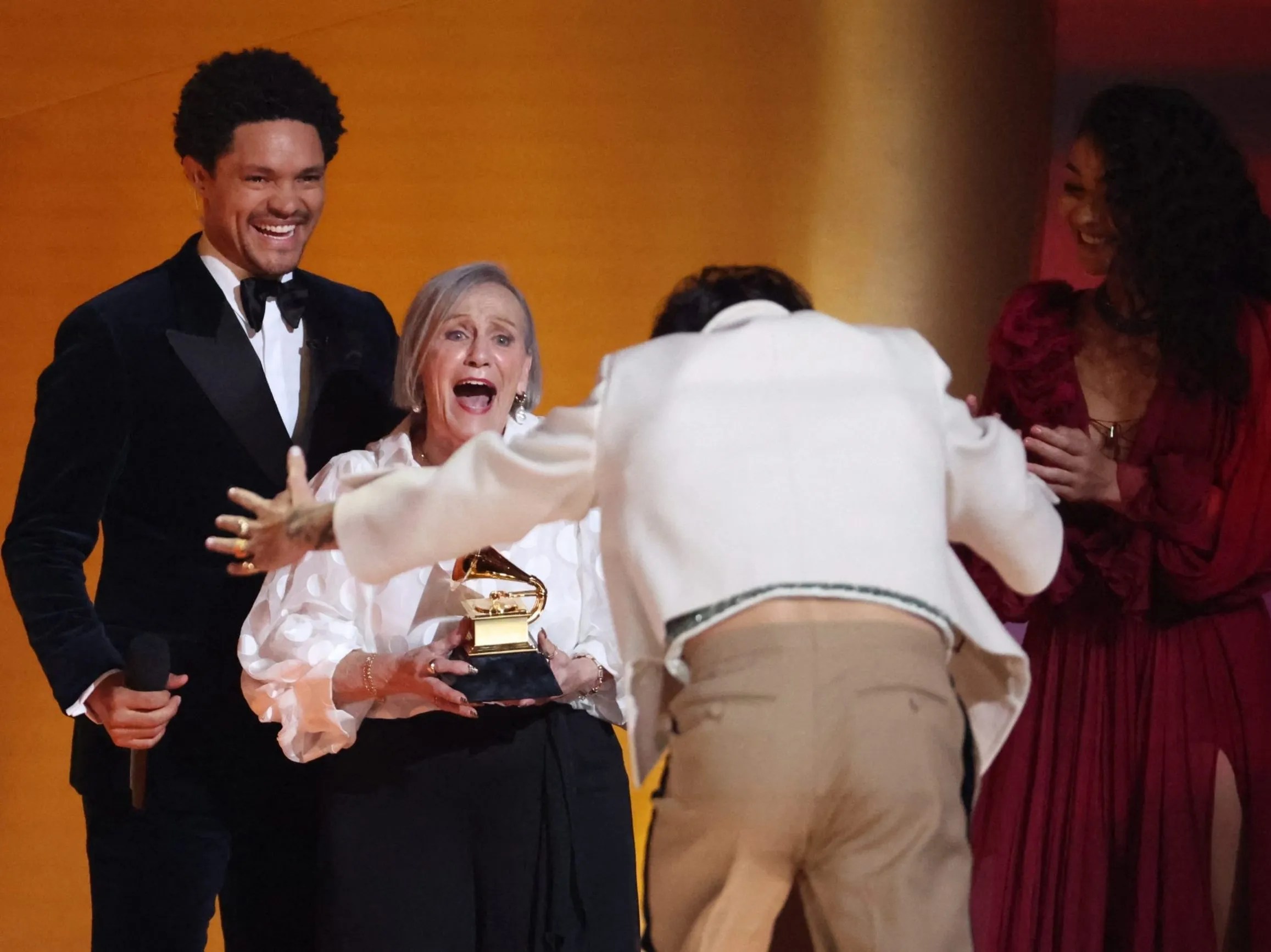 : The Toronto Sun Article Title: Harry Styles Reacts with Joy and Gratitude as He Accepts Album of the Year at the 65th Annual Grammy Awards 11